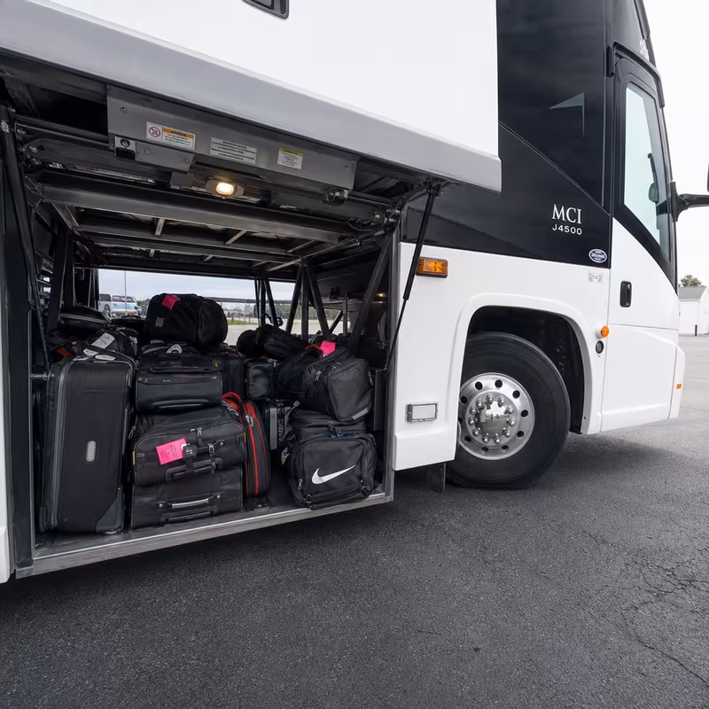 Party bus interior with wraparound leather seating and LED lighting in St Paul
