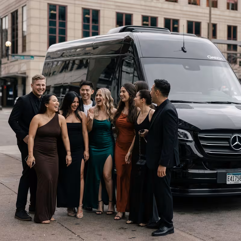 Group boarding a white charter bus for Bachelor & Bachelorette Transportation transportation in St Paul