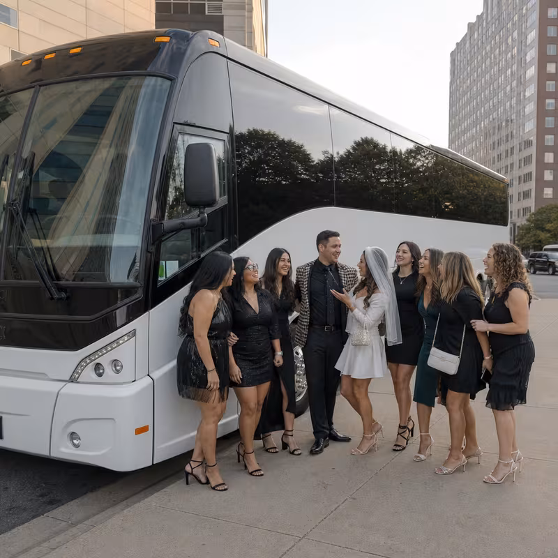 Passengers loading luggage while boarding an St Paul group shuttle
