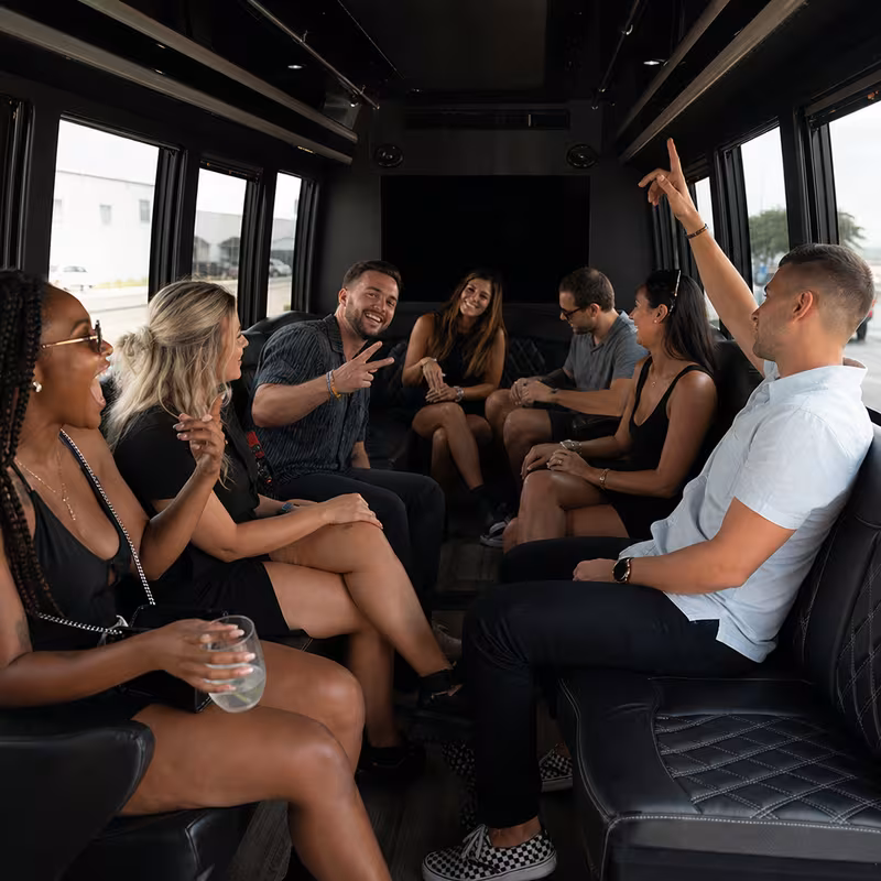 Group boarding a white charter bus for Concert Transportation transportation in St Paul