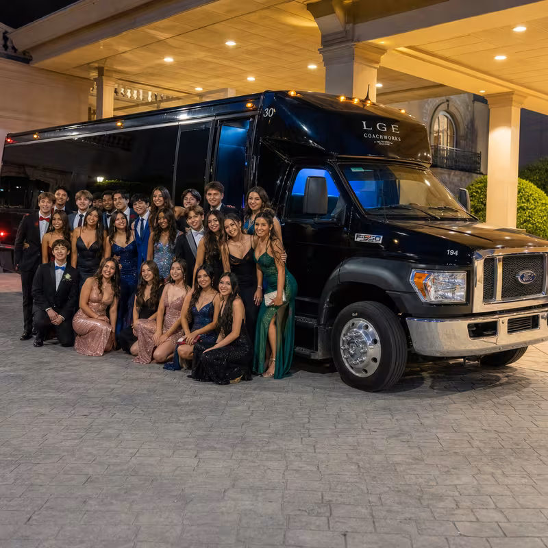 Party bus interior with wraparound leather seating and LED lighting in St Paul