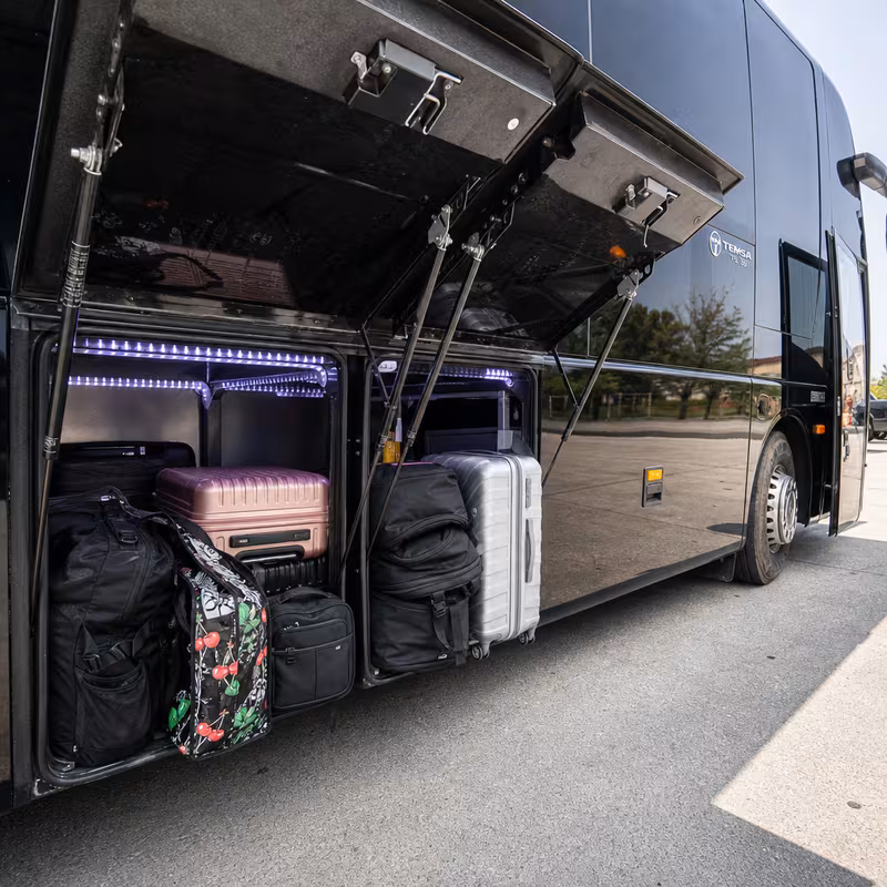Party bus interior with wraparound leather seating and LED lighting in St Paul