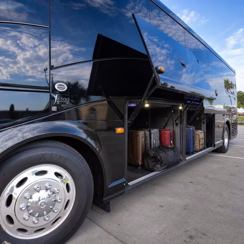 Party bus interior with wraparound leather seating and LED lighting in St Paul